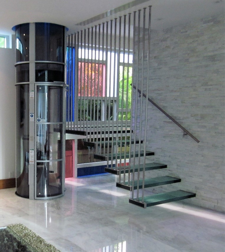 pve elevator installed in a corner near a stairwell of a home